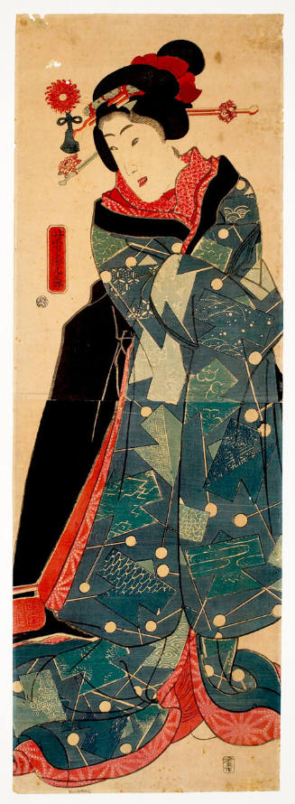 a woman in geometric patterned kimono & fancy headdress