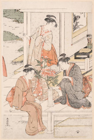 Women Arranging Flowers Beside a Garden